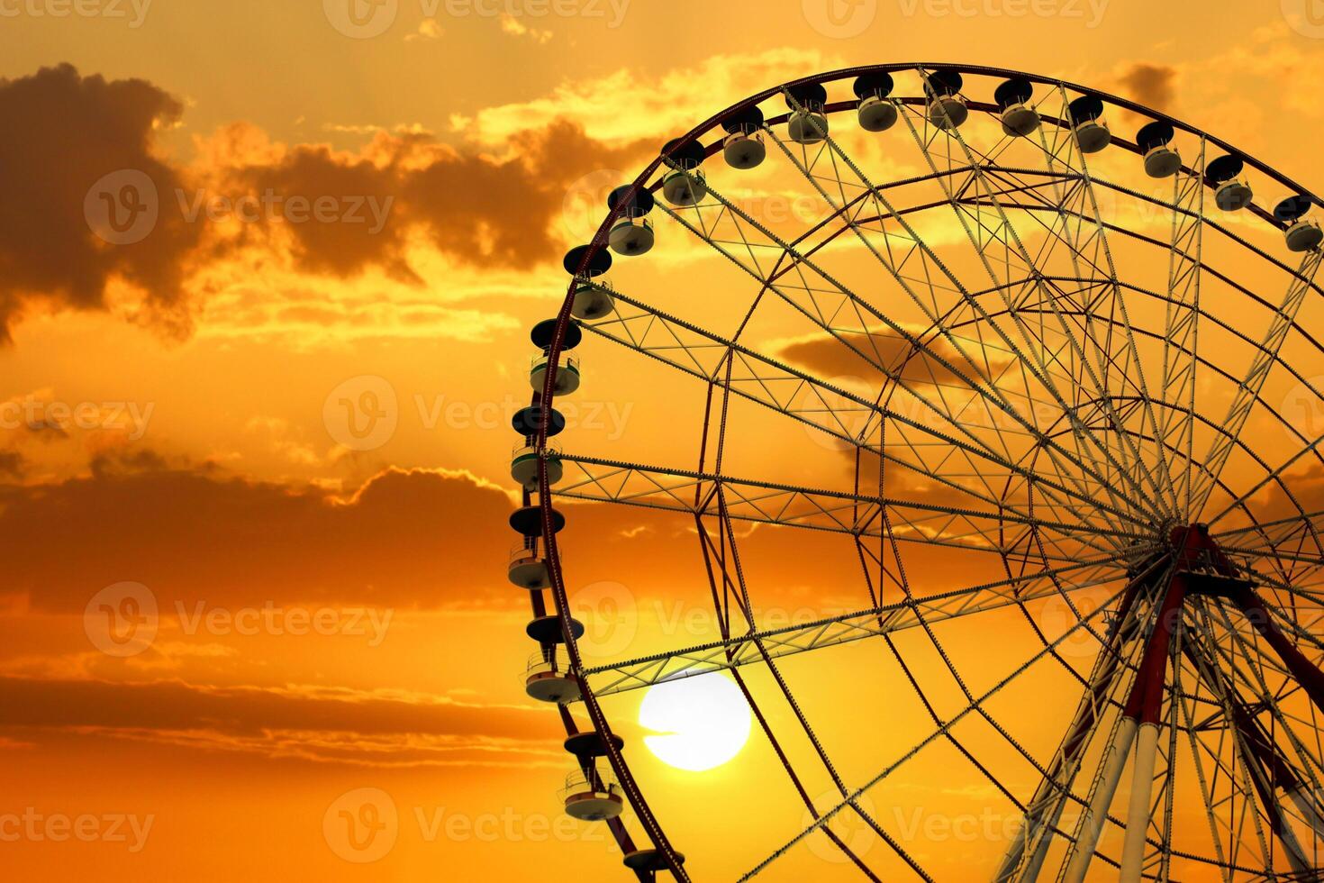 Ferris wheel in a playground in Batumi Square. Amazing and fanfastic sky. photo