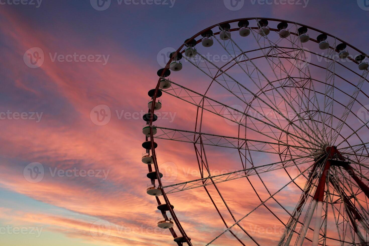 Ferris wheel in a playground in Batumi Square. Amazing and fanfastic sky. photo