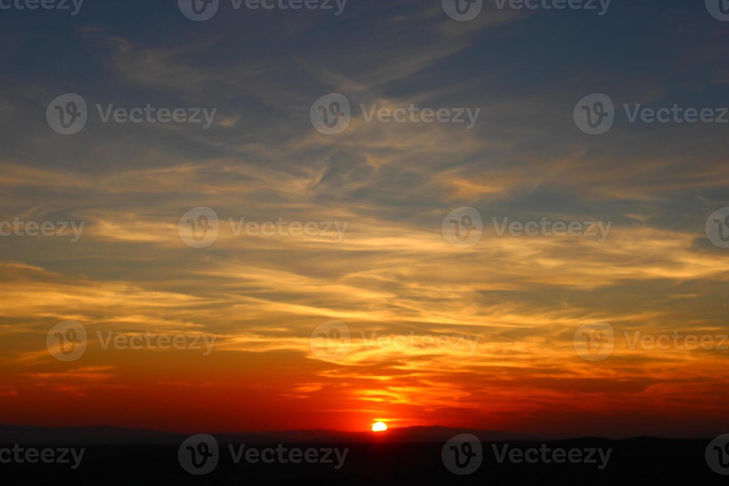 Cumulus clouds and different color tones in the sky at sunset. Amazing and incredible sunset. photo