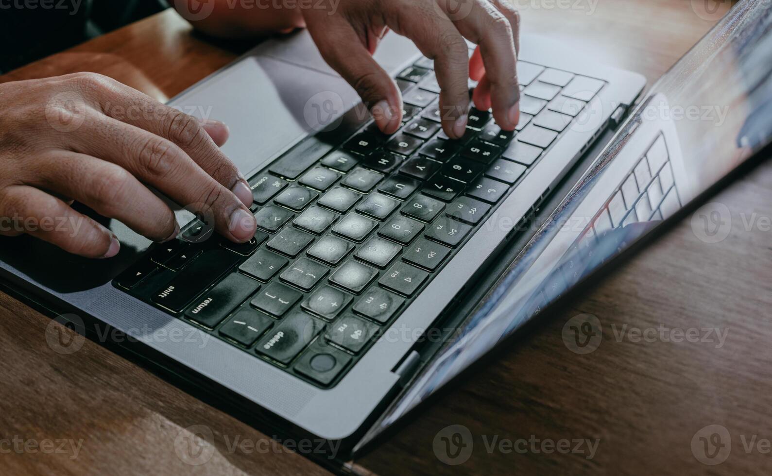 Business man working with laptop. Man hands typing on laptop keyboard. Manager work process. Laptop on wooden table. Social networking, planning, communication. photo