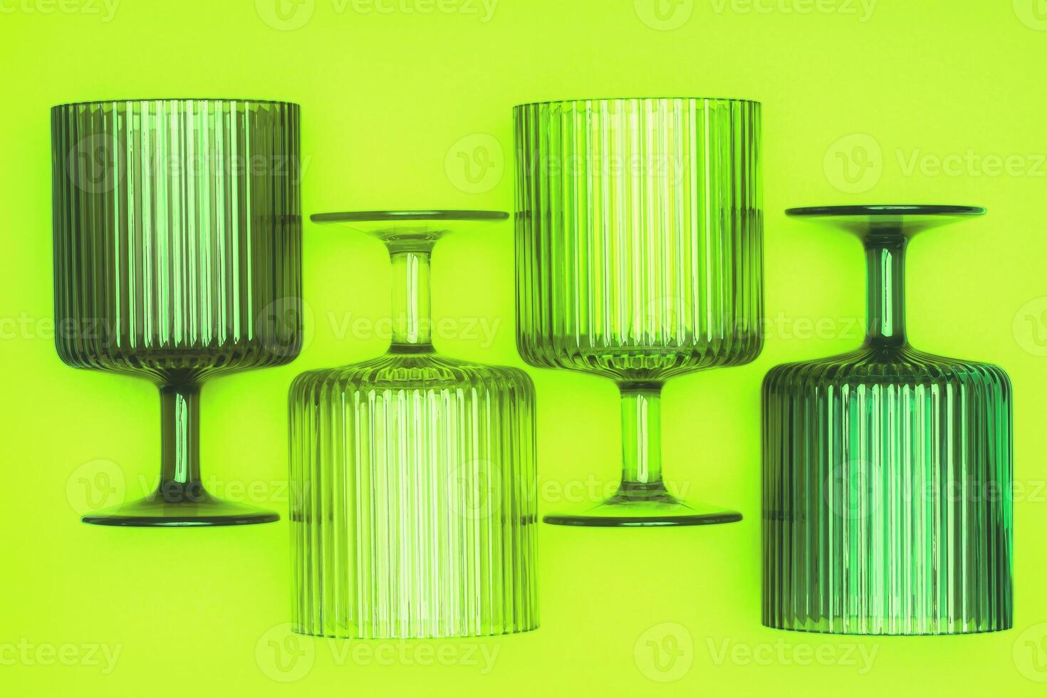 Glasses on a Bright Green and Yellow Background for Saint Patricks Day. photo