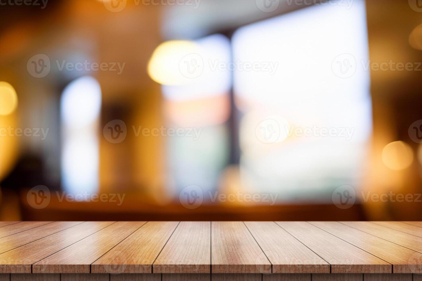 Empty wooden table top with lights bokeh on blur restaurant background. photo