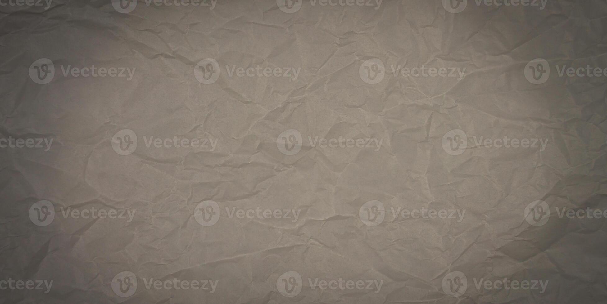 Texture of brown craft crumpled paper. Abstract background. Banner. Place for text. Selective focus. photo