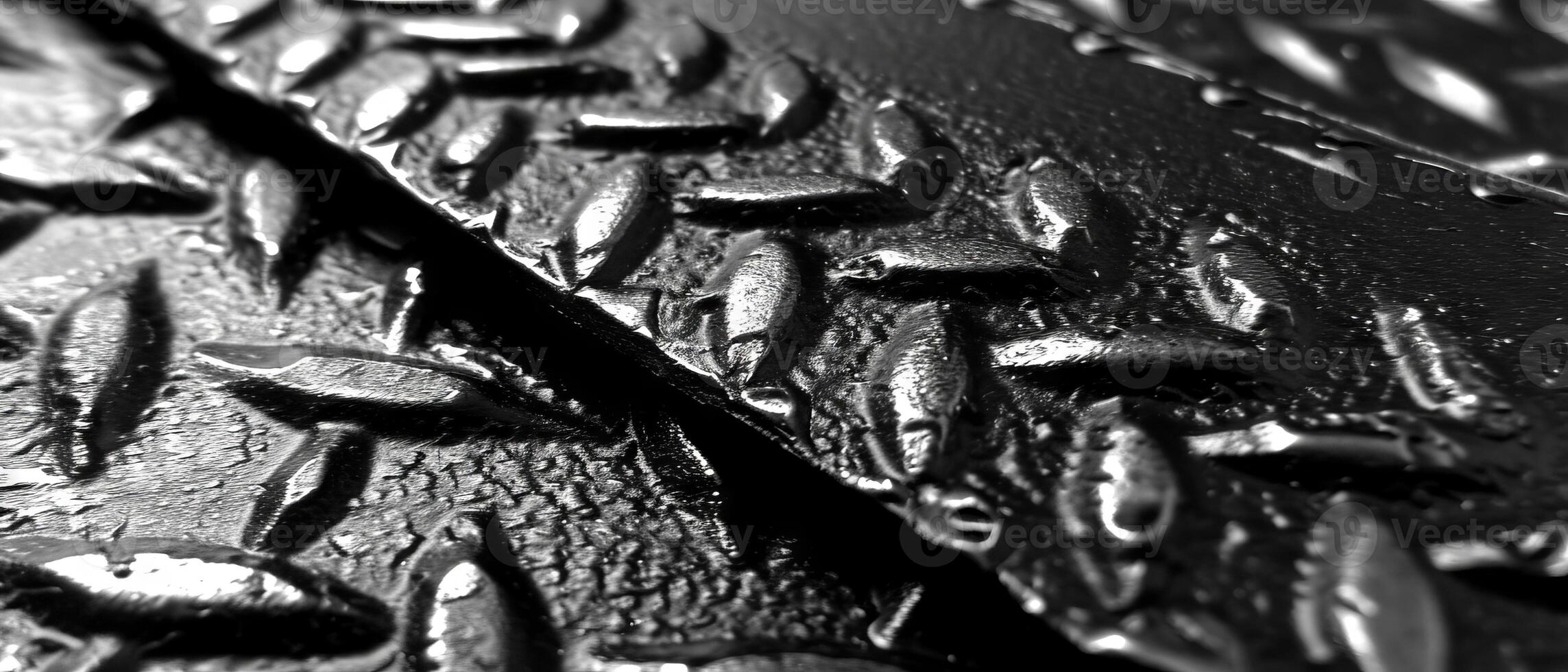 AI generated Macro shot of glistening water droplets on a textured black perforated metal surface photo