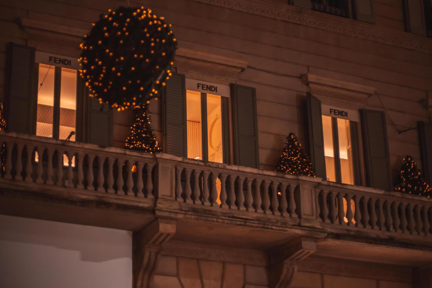 Christmas street of evening Milan. Montenapoleone District. Street and shops decorated with glowing garlands during the Christmas and New Year holidays in Milan, Italy 4.12.2023 photo