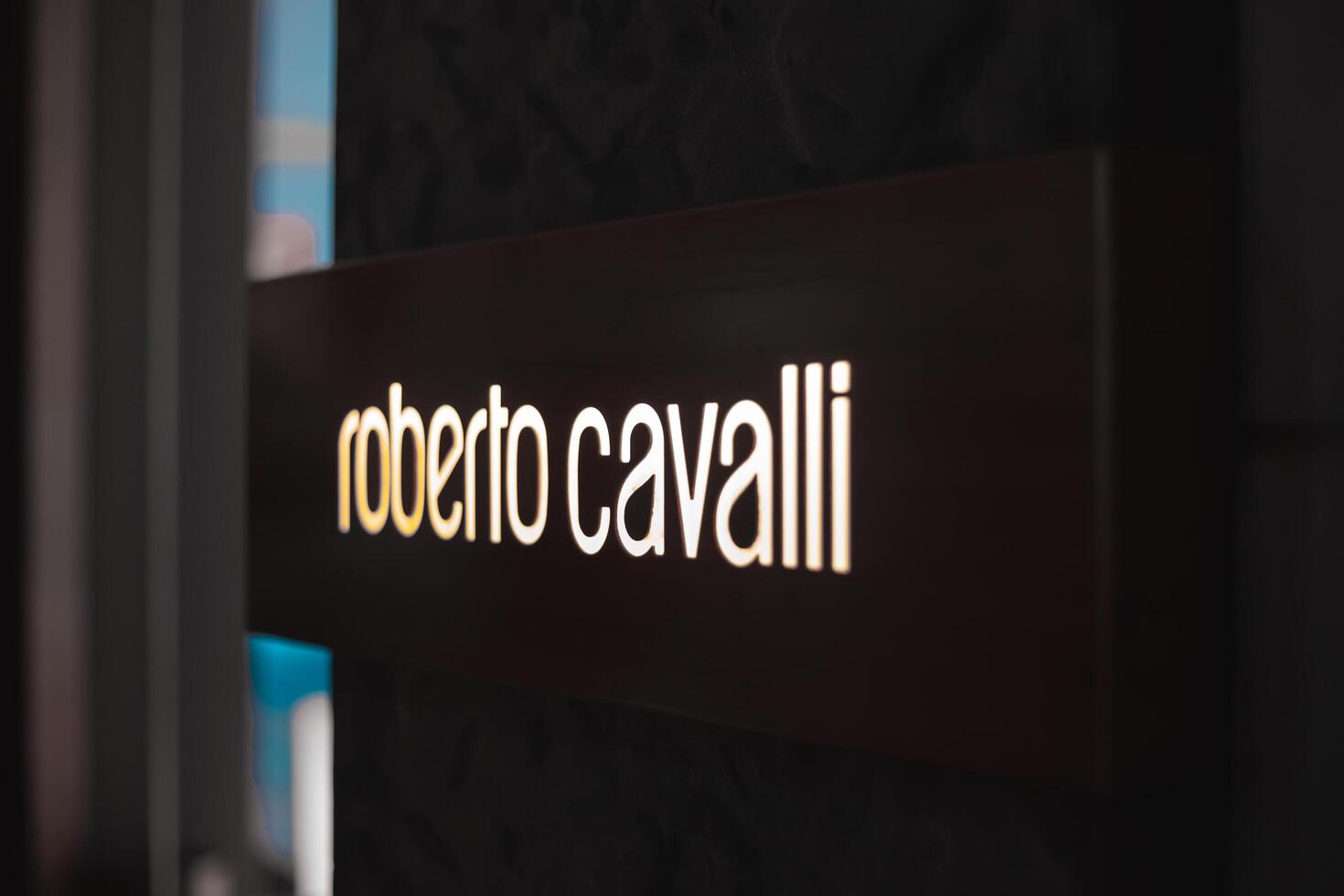 Roberto Cavalli shopping store. Via Monte napoleone fashion district in downtown Luxury shop boutique windows for Christmas decorations. Europe, Italy, Milan 5.12.2023 photo