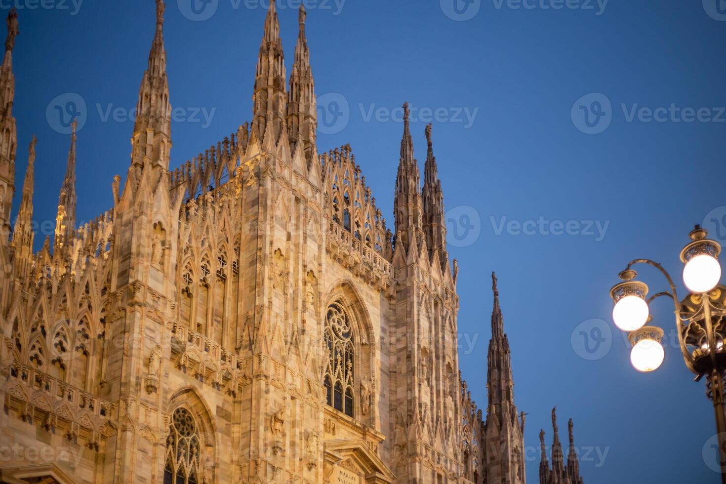Christmas holiday tree near the Duomo in Milan. Piazza del Duomo. Duomo square in december, night view photo