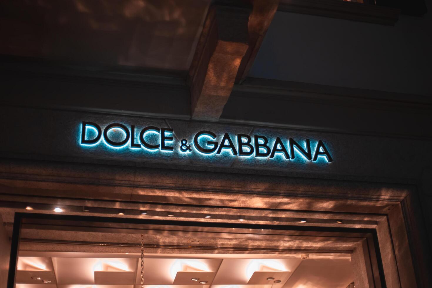 Dolce i Gabbana store at via Monte Napoleone street in Milan, Italy. One of the most luxurious areas in the city, with many famous shops. Luxury and fashion concept. Milan, Italy 2.12.2023 photo
