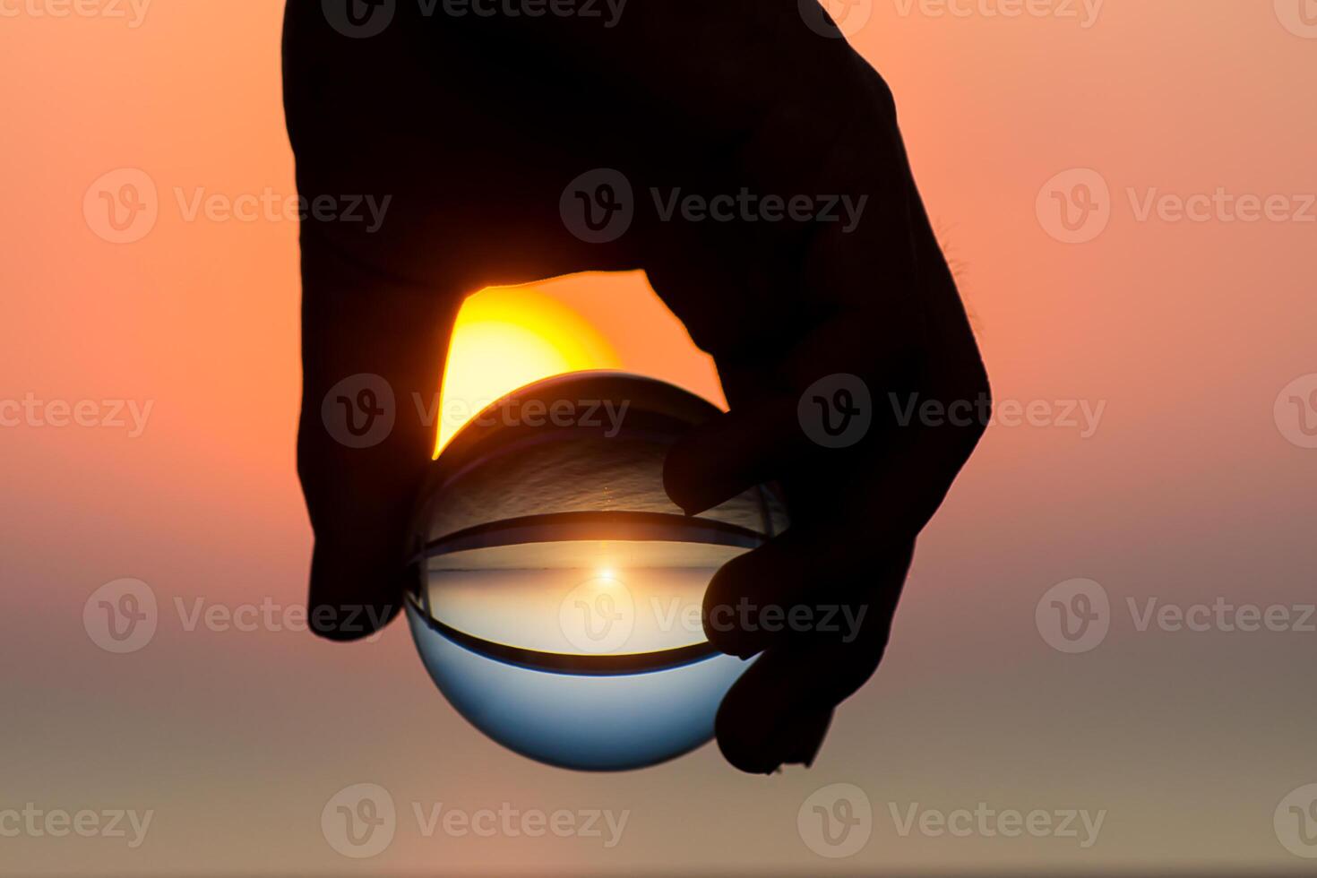Crystal in hand at sunset. photo