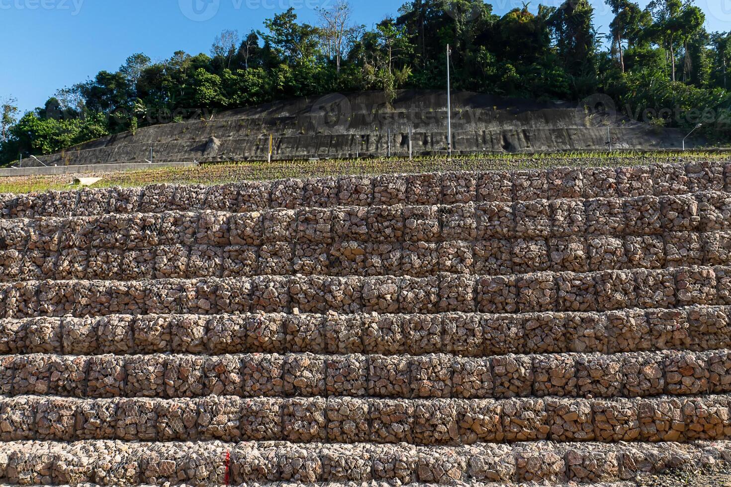 Rock wall protects mountain landslide photo