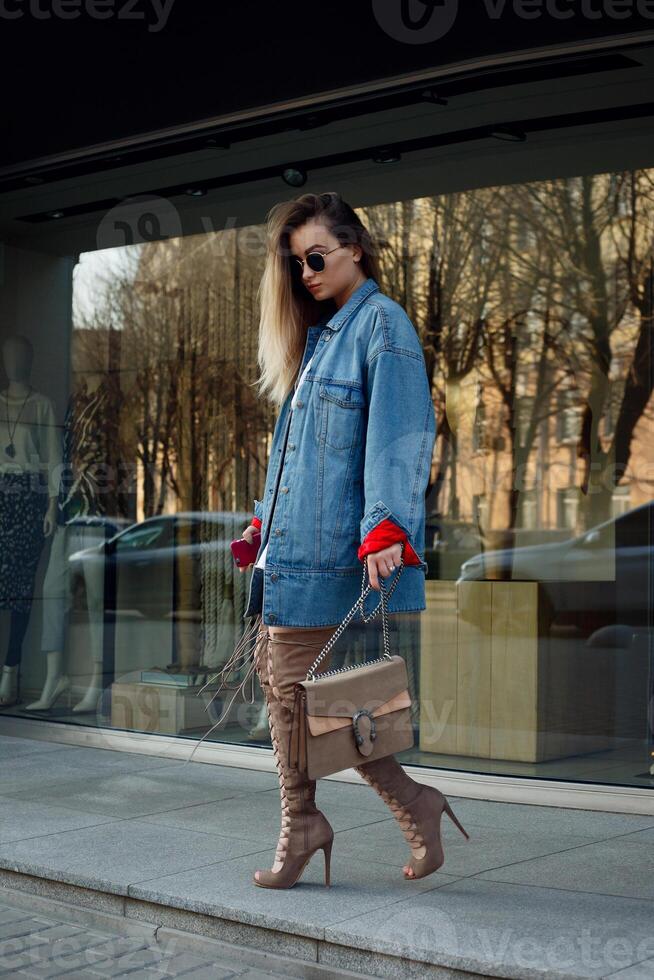 beautiful young woman with over the knee boots photo