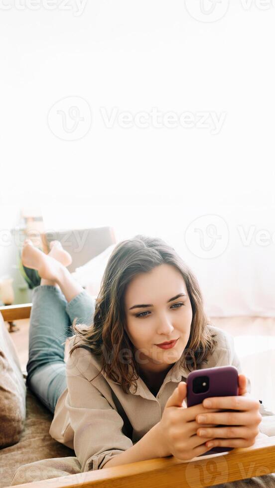 Digital Connection. Smiling Young Woman Engaged in Smartphone Typing, Social Network Chatting, and Internet Surfing. Modern Communication and Social Media Lifestyle Concept photo