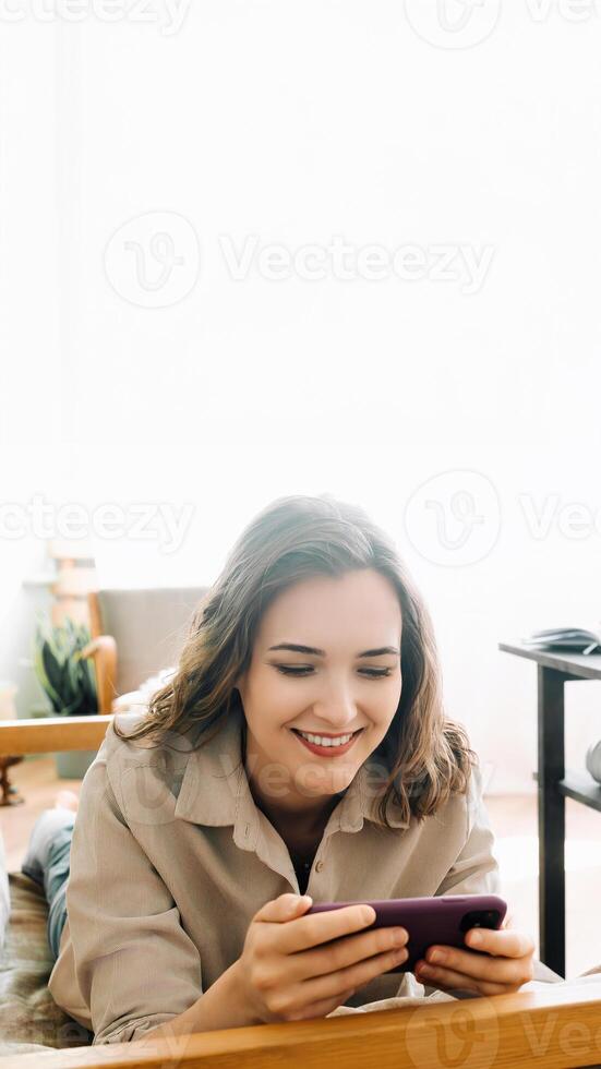 Woman Embracing Digital Connection. Reading Messages, Socializing on Social Media, and Playing Mobile Games on Smartphone. Happy Young Female Engaging in Modern Digital Communication and Entertainment photo