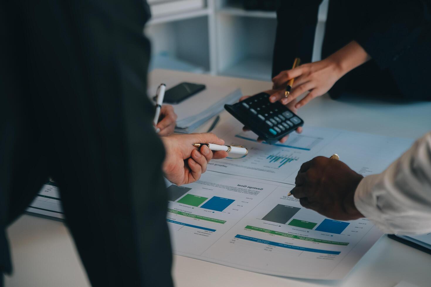 Business team working with new startup project plan and discussion information for financial strategy with laptop and digital tablet in a modern business lounge. photo