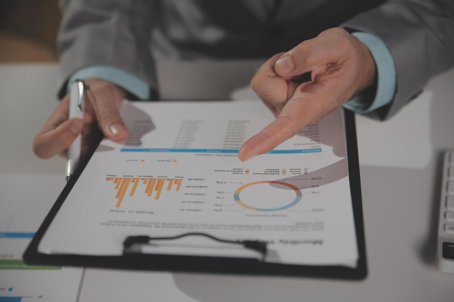 Business team working with new startup project plan and discussion information for financial strategy with laptop and digital tablet in a modern business lounge. photo