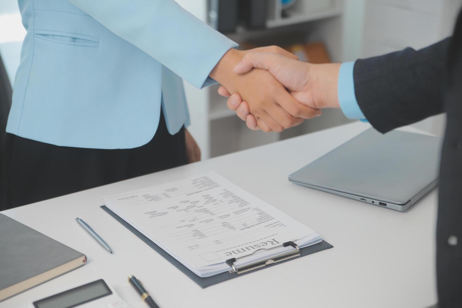 Close up view of job interview in office, focus on resume writing tips, employer reviewing good cv of prepared skilled applicant, recruiter considering application, hr manager making hiring decision photo