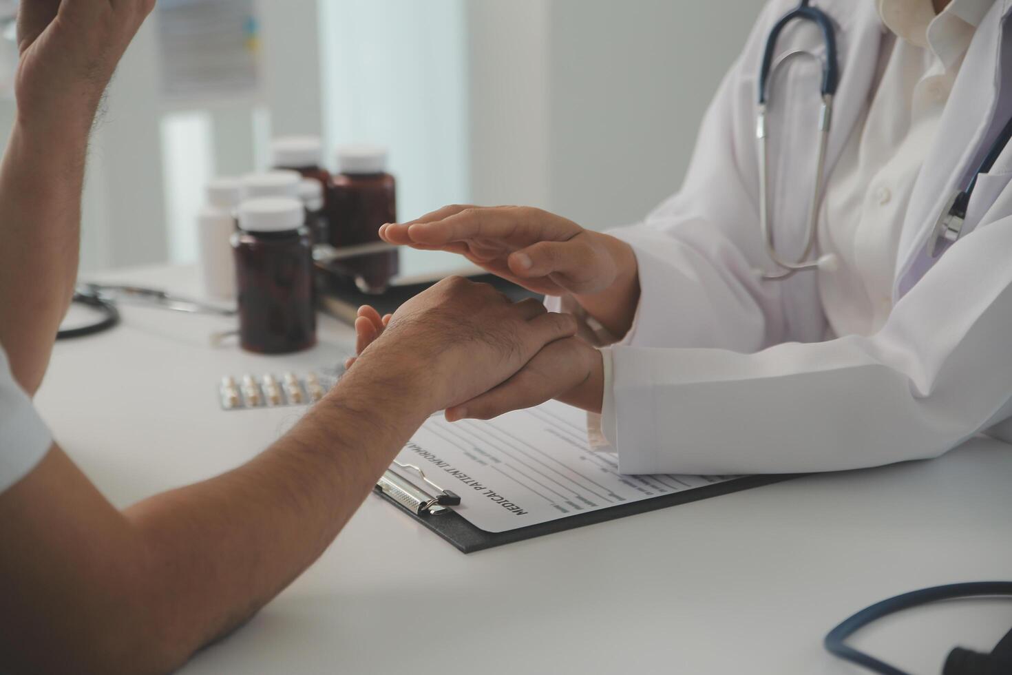 Homecare nursing service and elderly people cardiology healthcare. Close up of young hispanic female doctor nurse check mature caucasian man patient heartbeat using stethoscope during visit photo