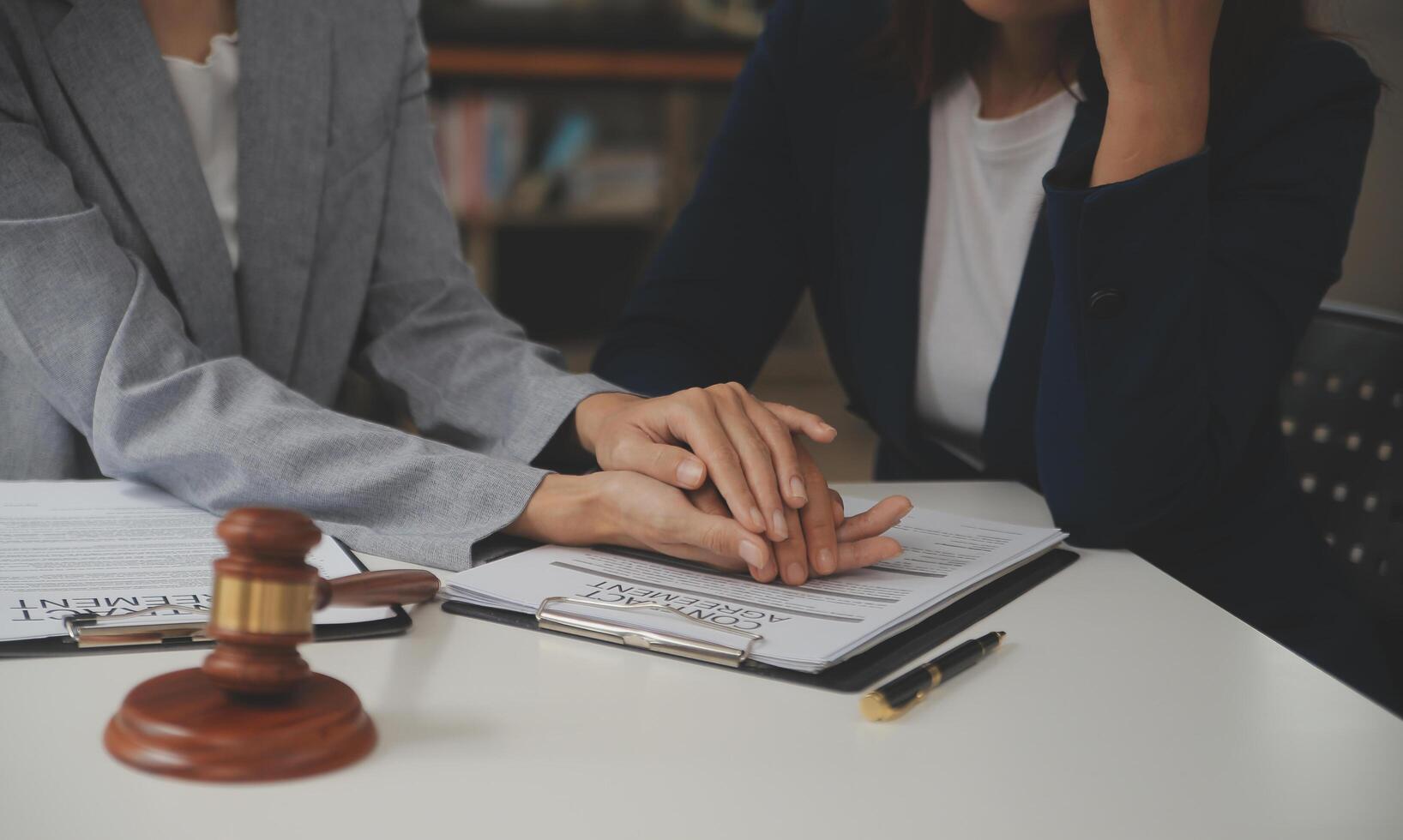 Lawyer, legal advisor, businessman brainstorming information on agreement details Business contracts in legal processing books for accuracy in contract documents. joint financial investment. photo