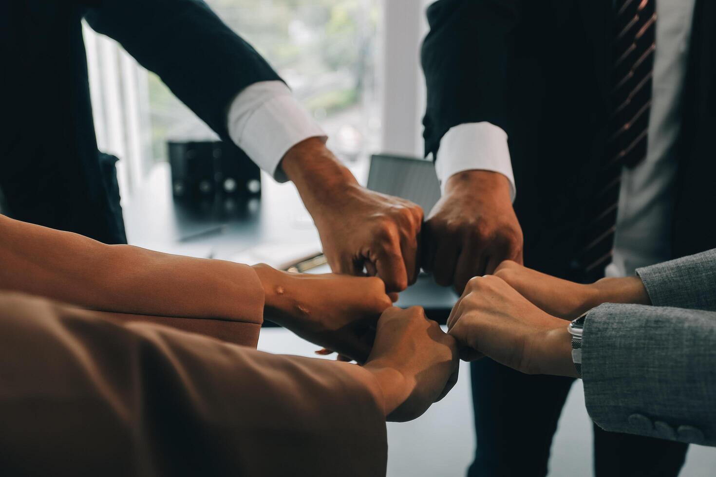 Group of college touch hands for unity group to success business. photo