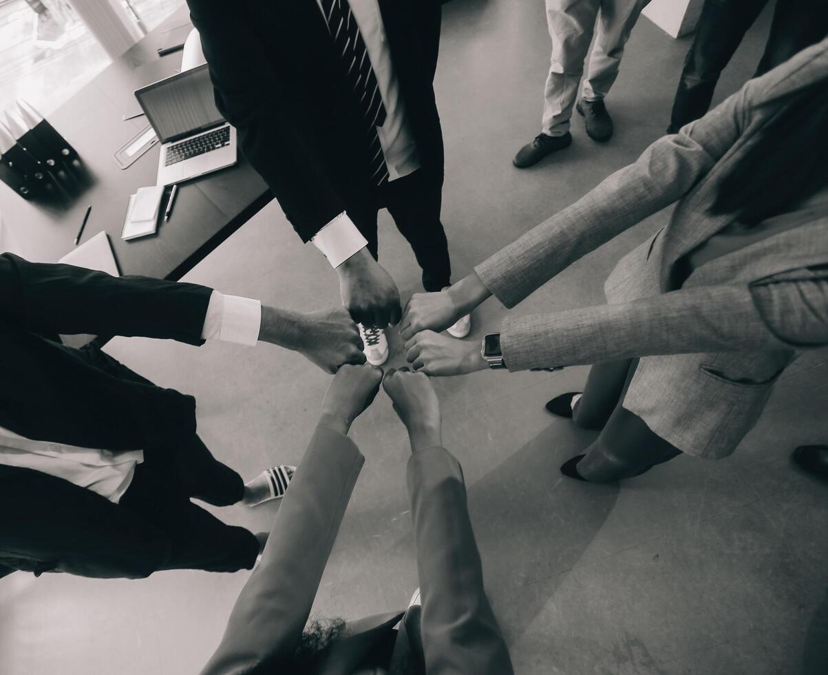 Group of college touch hands for unity group to success business. photo