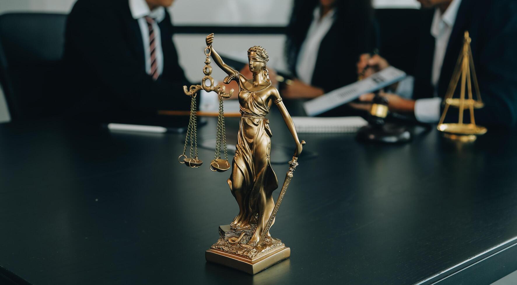 Judge gavel with Justice lawyers having team meeting at law firm background. Concepts of Law and Legal services. photo