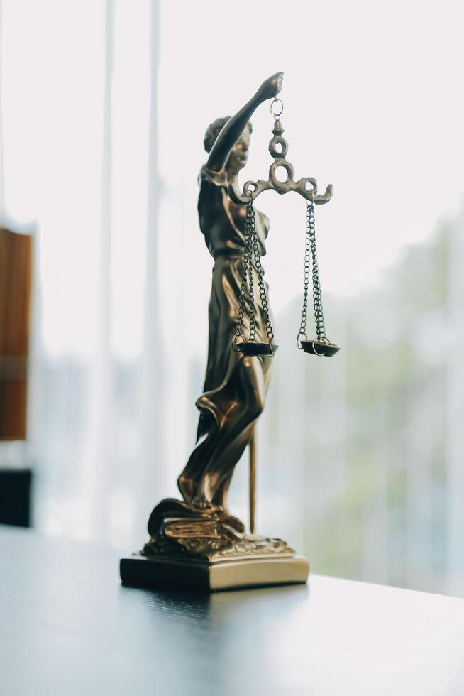 Judge gavel with Justice lawyers having team meeting at law firm background. Concepts of Law and Legal services. photo