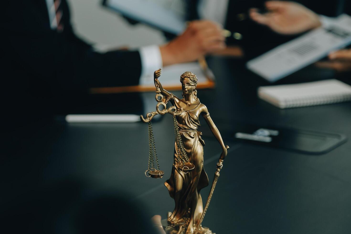 Judge gavel with Justice lawyers having team meeting at law firm background. Concepts of Law and Legal services. photo