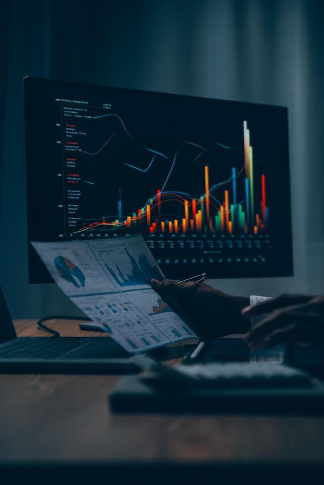 Thoughtful focused successful caucasian male stock investor, broker, financial adviser, sits at work desk, looks at computer, pensively analyze risks and prospects, rise or fall of cryptocurrency coin photo
