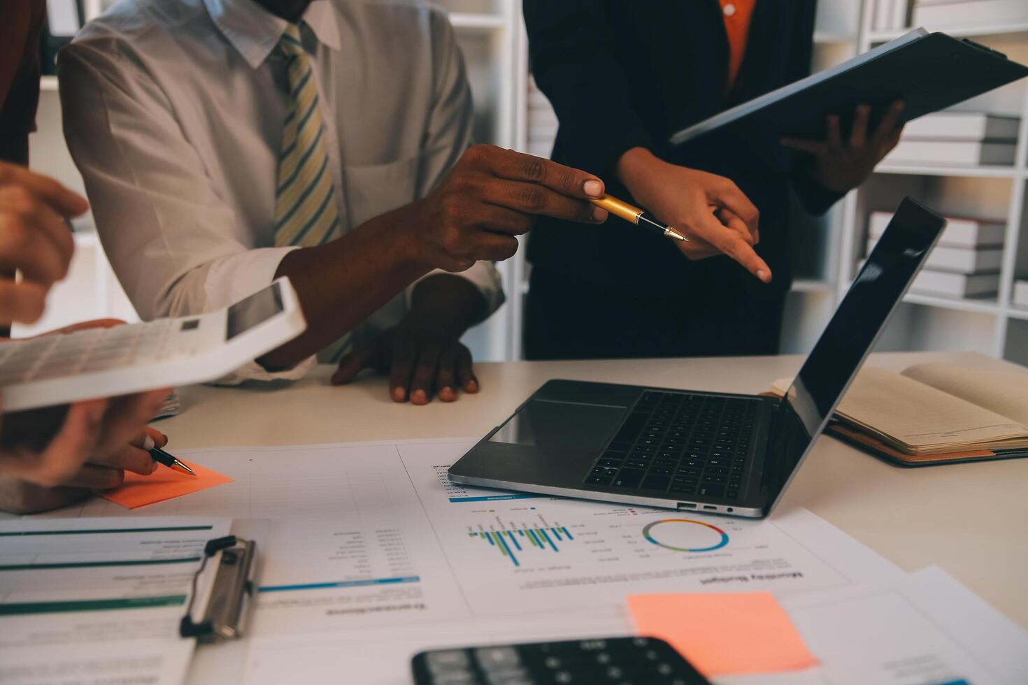 Co working conference, Business team meeting present, investor colleagues discussing new plan financial graph data on office table with laptop and digital tablet, Finance, accounting, investment. photo