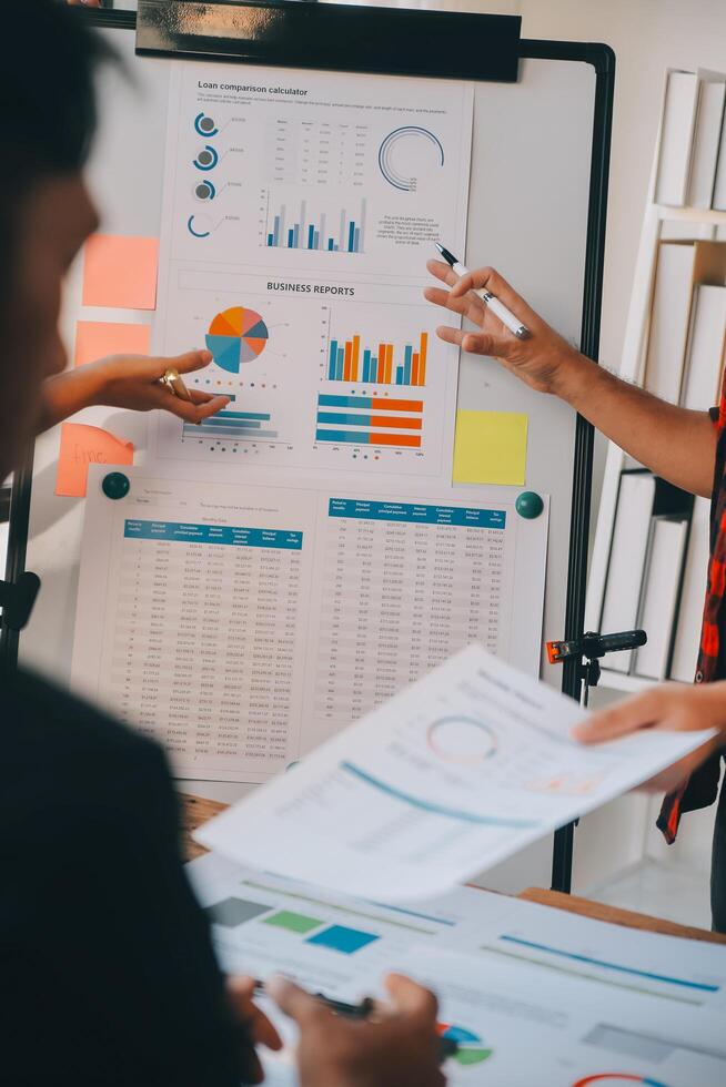 Co working conference, Business team meeting present, investor colleagues discussing new plan financial graph data on office table with laptop and digital tablet, Finance, accounting, investment. photo