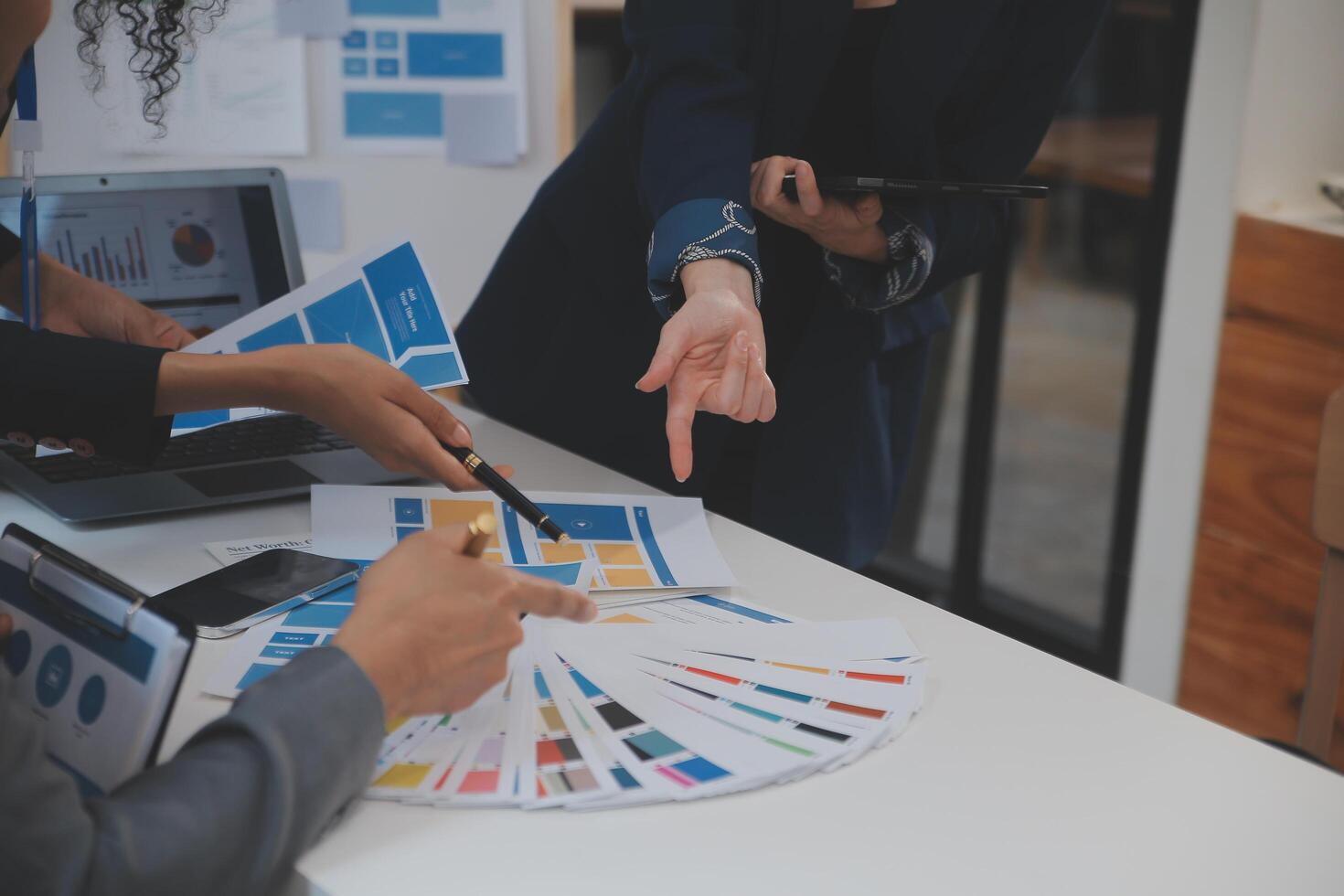 Close up ux developer and ui designer use augmented reality brainstorming about mobile app interface wireframe design on desk at modern office.Creative digital development agency photo