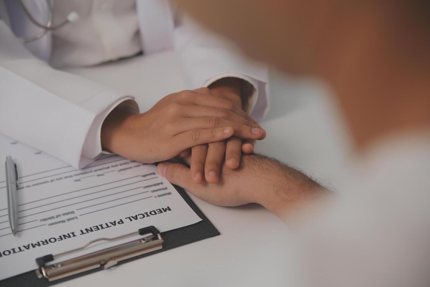 Homecare nursing service and elderly people cardiology healthcare. Close up of young hispanic female doctor nurse check mature caucasian man patient heartbeat using stethoscope during visit photo