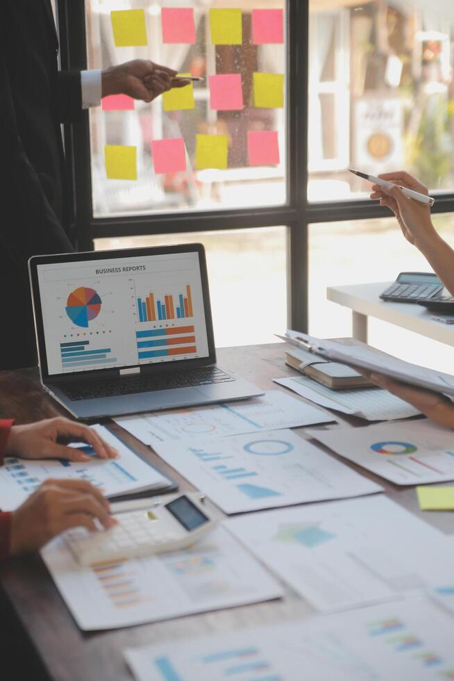 Finance manager meeting discussing company growth project success financial statistics, professional investor working start up project for strategy plan with document, laptop and digital tablet. photo
