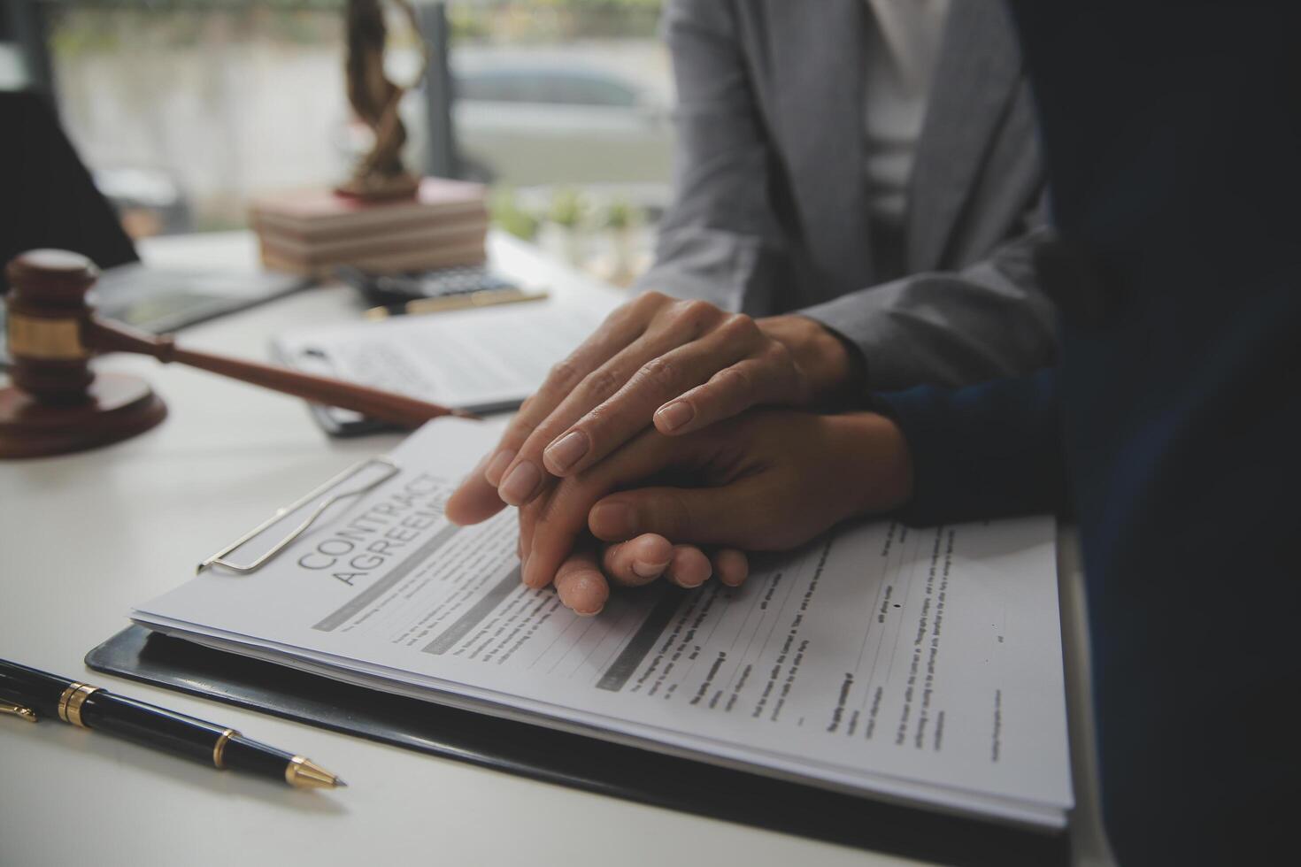 Lawyer, legal advisor, businessman brainstorming information on agreement details Business contracts in legal processing books for accuracy in contract documents. joint financial investment. photo
