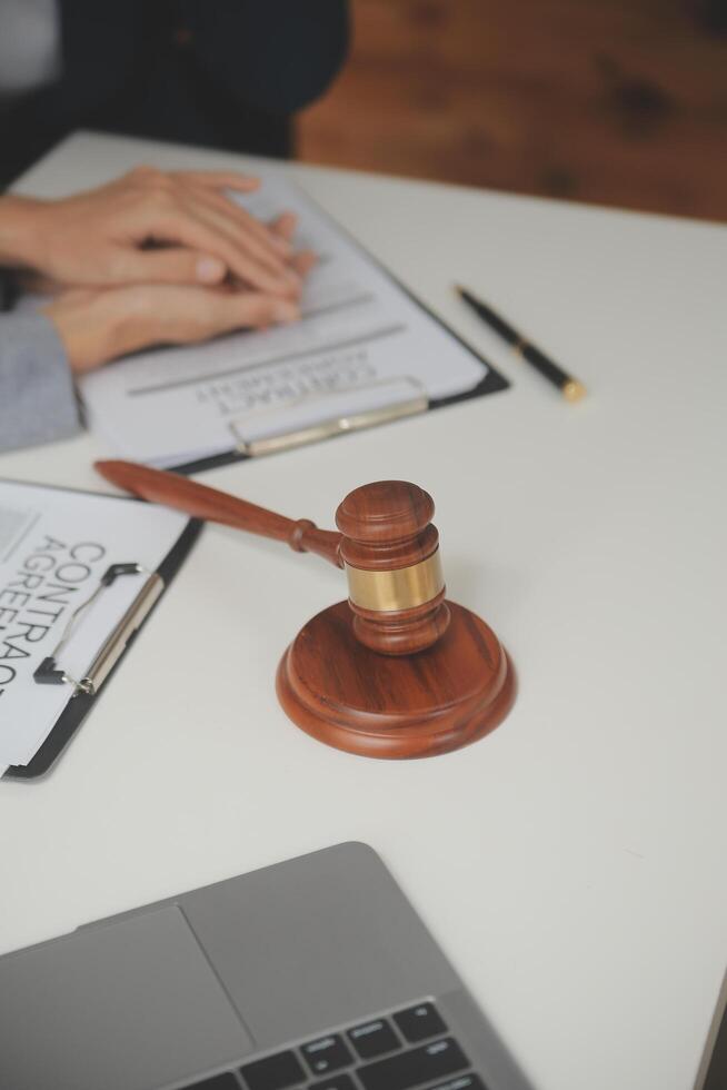 Lawyer, legal advisor, businessman brainstorming information on agreement details Business contracts in legal processing books for accuracy in contract documents. joint financial investment. photo