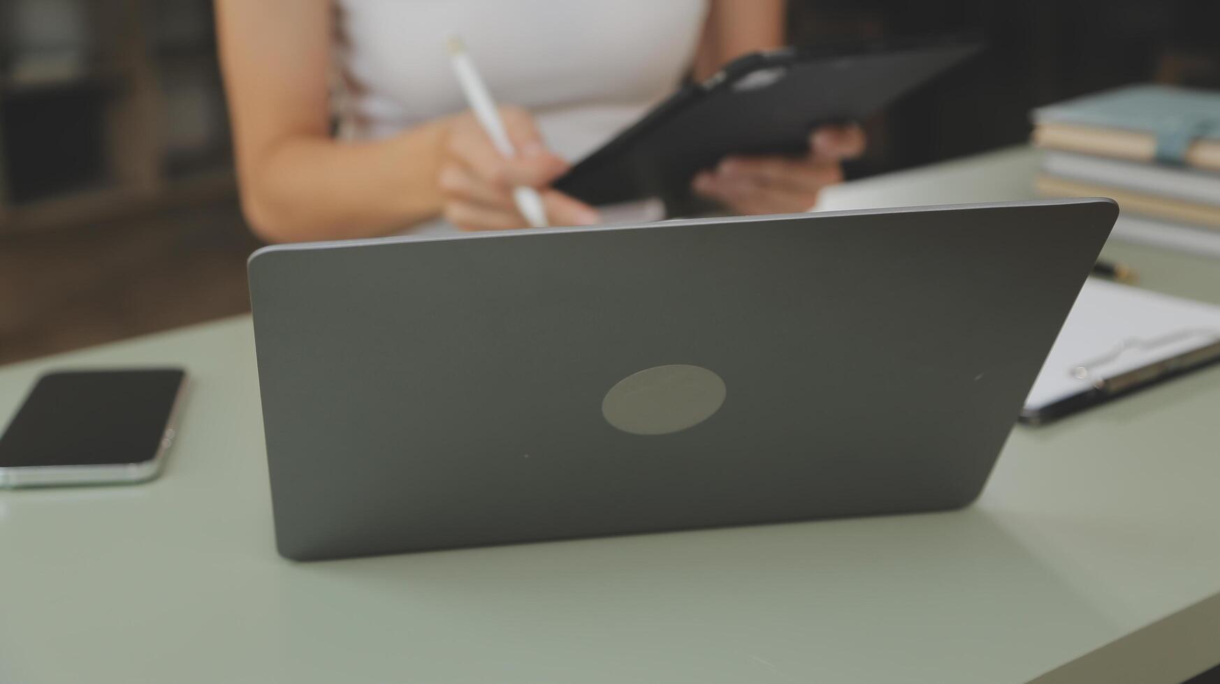 Asian businesswoman working on laptop computer Look for job online, freelance looking and typing on notebook on table, lifestyle of woman studying online photo