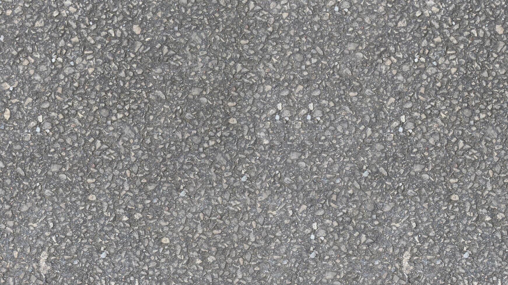 AI generated A uniform gray asphalt texture made up of small stones and pebbles in varying shades of gray like road texture background photo