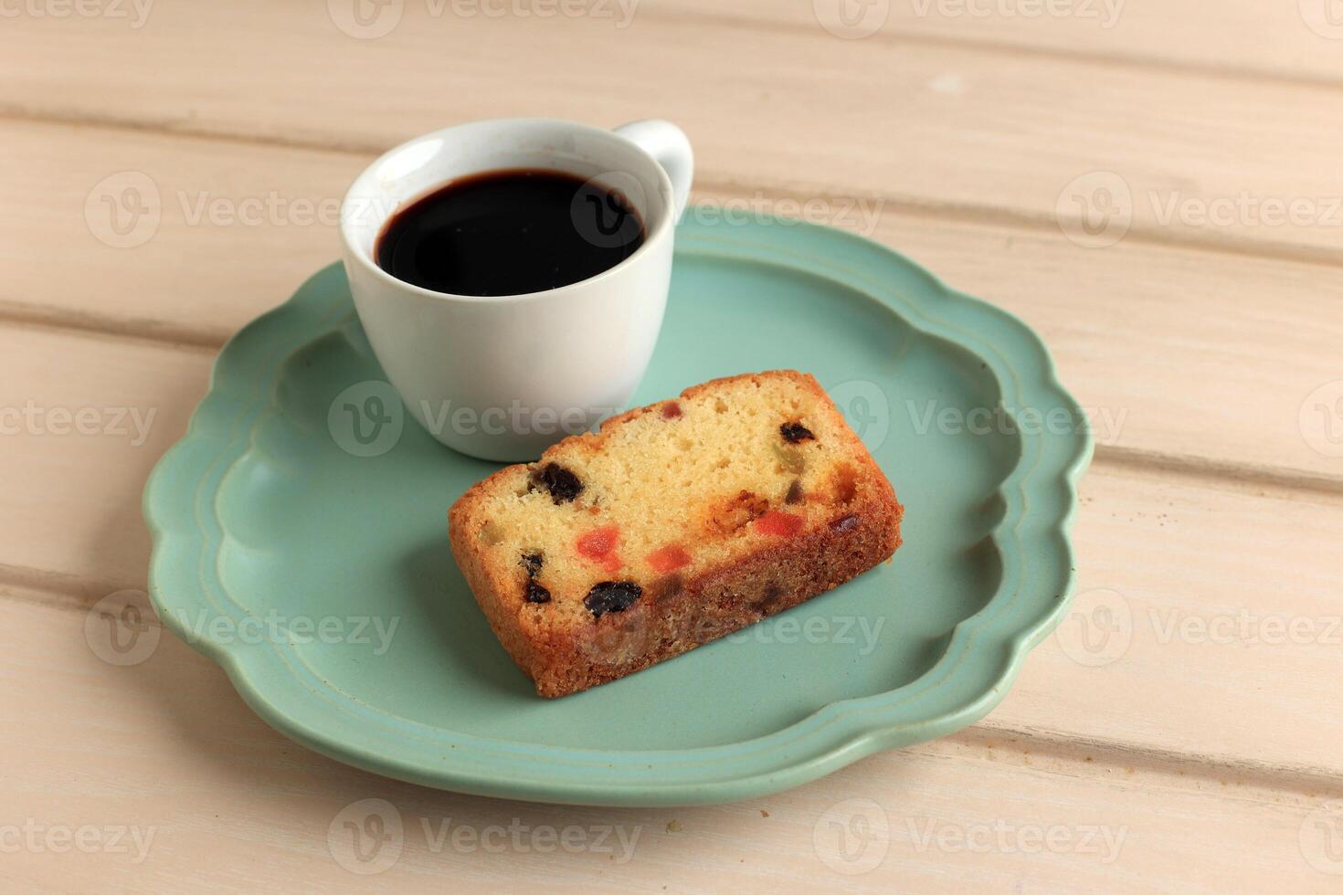 Slice Fruit Cake with A Cup of Coffee photo