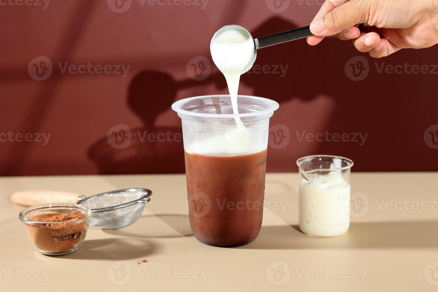 Pour Cream Topping to Ice Chocolate photo