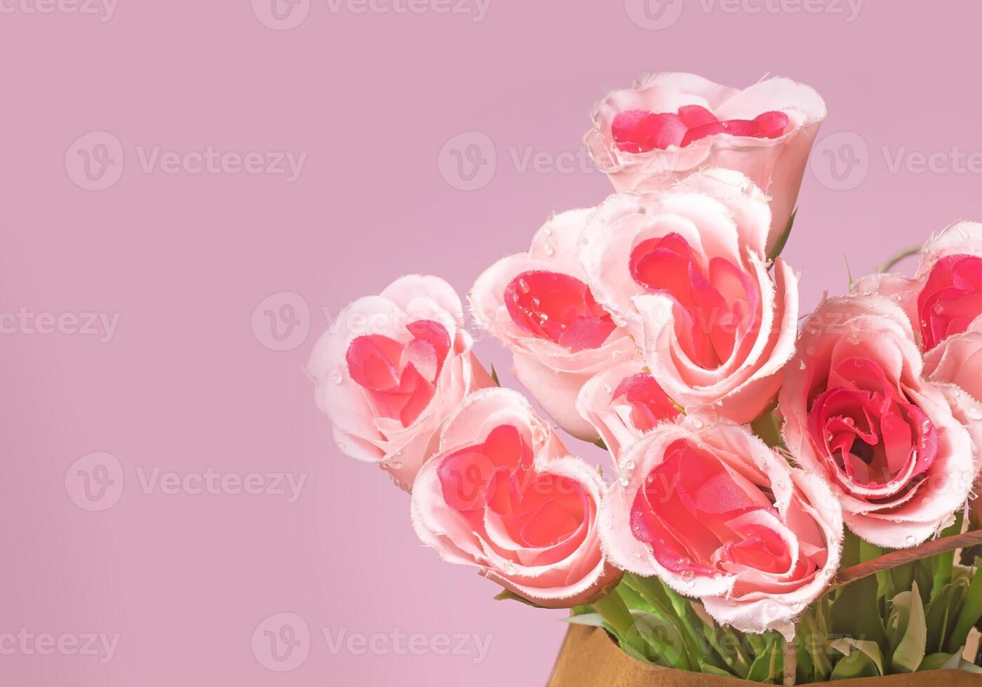 Valentine's Day concept. Bouquet of pink roses in box on pink background with copy space photo