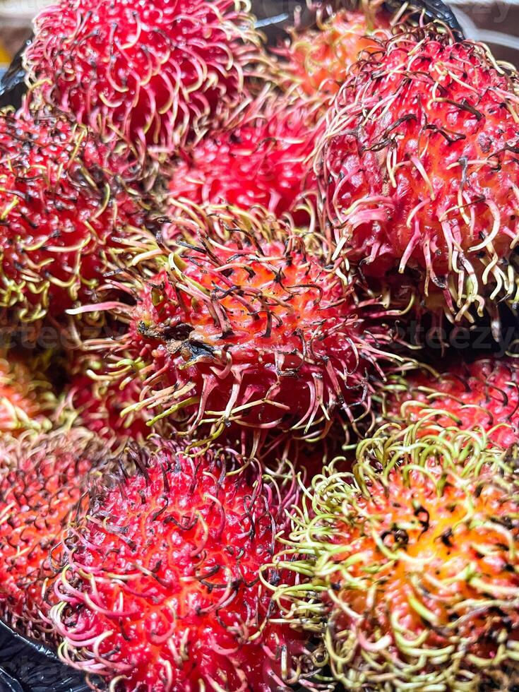 Fresh and ripe rambutan sweet tropical fruit photo