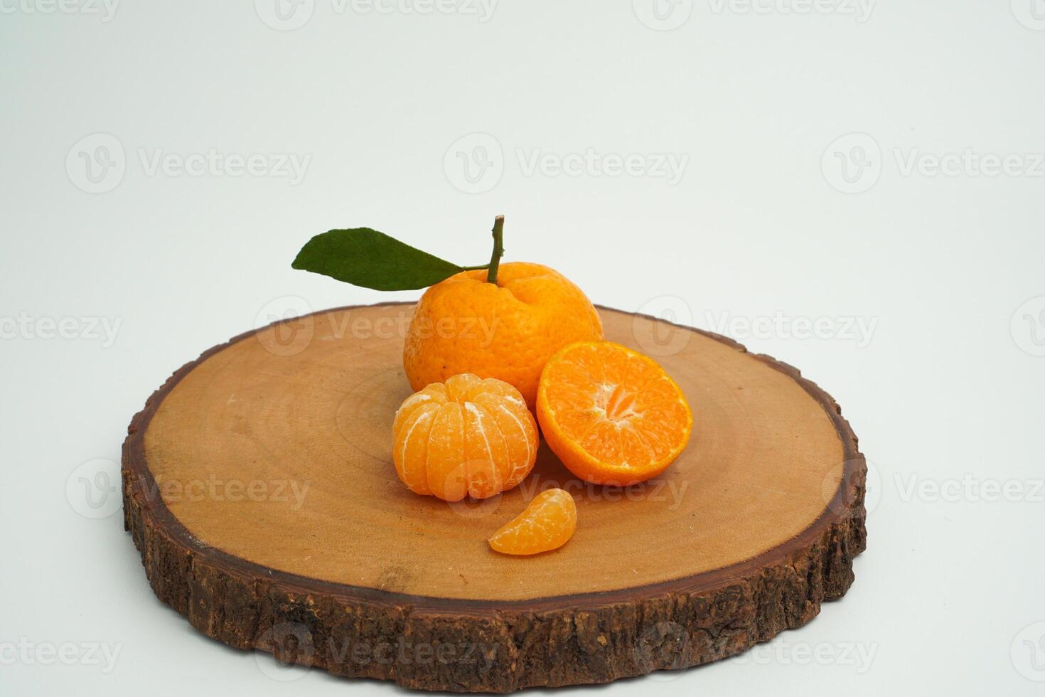 Group of orange fruit consists of whole, piece and half orange on wood isolated on white background photo