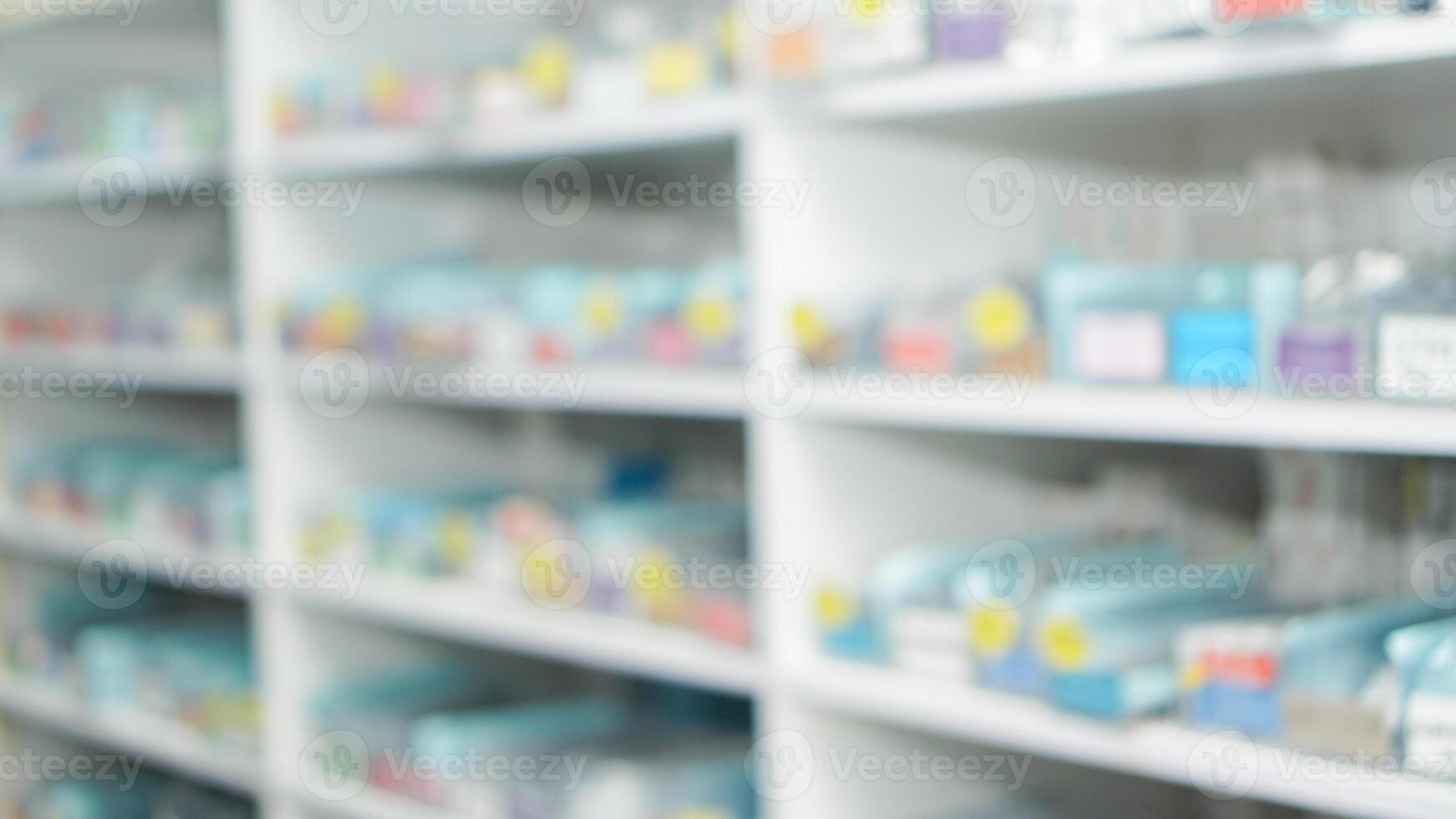 blur abstract background of medicine or drug in shelf in drugstore, pharmacy, clinic, and hospital photo