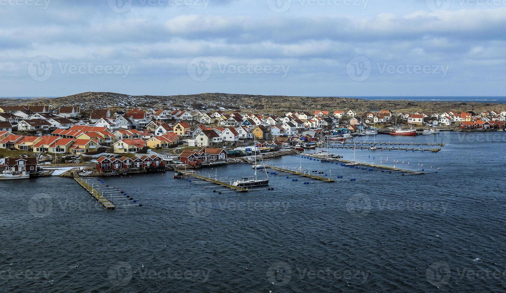 Aerial View of a Harbor With Boats and Houses in Sweden photo