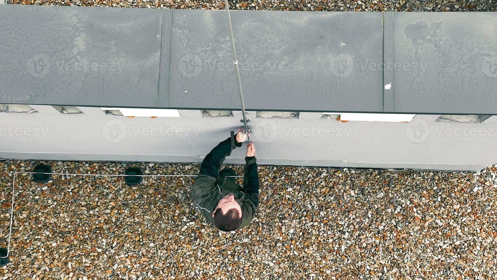 Aerial TOP view Roofing Lightning Protection System Rods being assembled by Lightning Protection Specialists photo