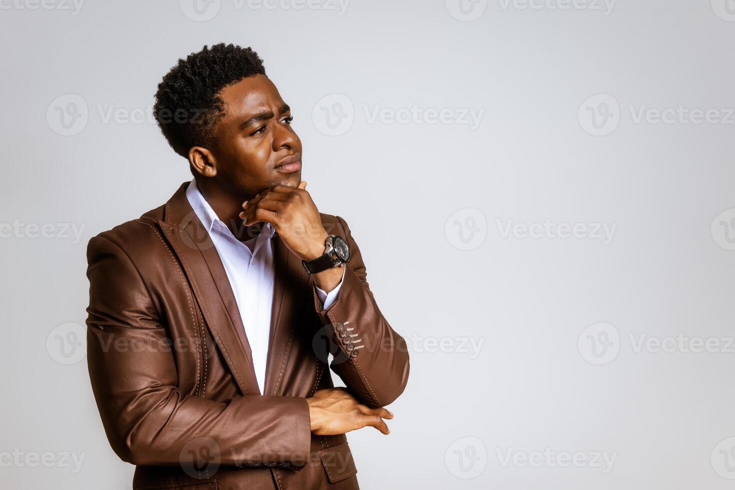Portrait of young businessman who is thoughtful and worried. photo