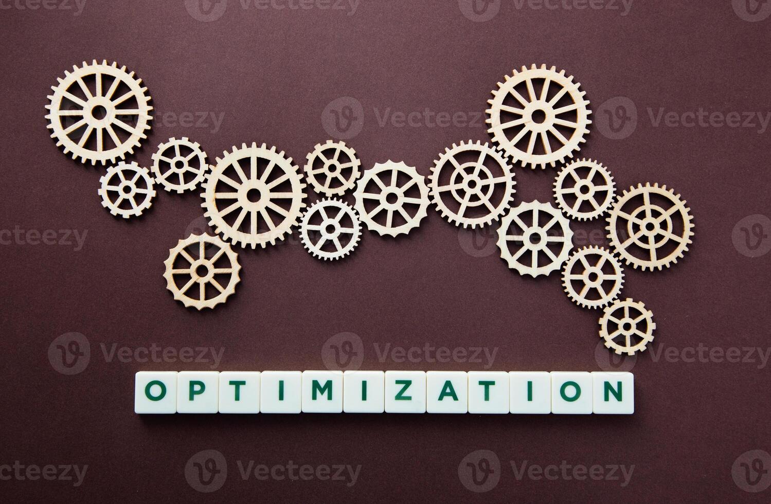 Wooden gear with the word Optimization. Technology concept and optimization. photo