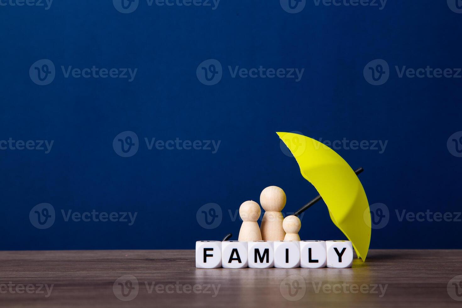 Umbrella and wooden doll figures. photo