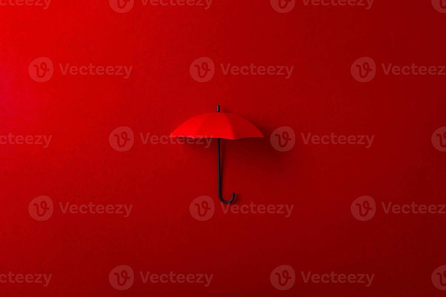 Red umbrella isolated on purple background. photo