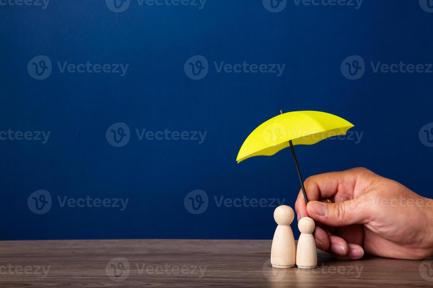 Hand holding umbrella and cover family. photo
